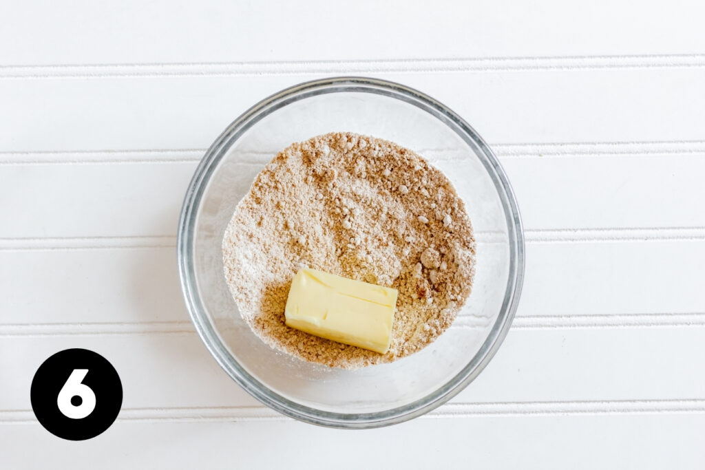 A firm chunk of butter added to the cinnamon sugar mixture.